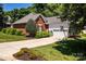 Attractive brick and siding home with a well-kept front yard and a basketball hoop at 2124 Congress Ct, Kannapolis, NC 28083