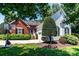 Inviting home featuring a combination of brick and siding, with a manicured landscape at 2124 Congress Ct, Kannapolis, NC 28083