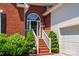 Charming brick home entrance with brick steps and a decorative arch window above the front door at 2124 Congress Ct, Kannapolis, NC 28083