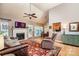 Open-concept living room with hardwood floors, fireplace, vaulted ceiling and access to dining at 2124 Congress Ct, Kannapolis, NC 28083