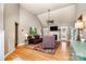 Spacious living room featuring a vaulted ceiling, fireplace, hardwood floors, and neutral paint at 2124 Congress Ct, Kannapolis, NC 28083
