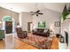 Spacious living room featuring vaulted ceilings, fireplace, hardwood floors and decor at 2124 Congress Ct, Kannapolis, NC 28083