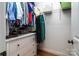 Organized walk-in closet with built-in shelves, hanging racks, and drawers for optimal storage at 2124 Congress Ct, Kannapolis, NC 28083
