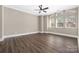 Spacious bedroom with neutral walls, wood flooring, and plenty of natural light from the large windows at 229 N Church St # 100, Charlotte, NC 28202