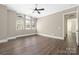 Bright bedroom with large windows, wood floors, and neutral walls providing a serene and inviting atmosphere at 229 N Church St # 100, Charlotte, NC 28202