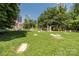 Scenic view of a cemetery with green grass and trees with a cityscape in the background at 229 N Church St # 100, Charlotte, NC 28202