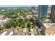 Cityscape featuring verdant parklands from high above; blending urban living with natural, peaceful settings at 229 N Church St # 100, Charlotte, NC 28202