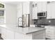 Close up of kitchen featuring stainless steel appliances, stone countertops, and ample cabinet space at 229 N Church St # 100, Charlotte, NC 28202