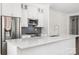 Kitchen featuring stainless steel appliances, stone countertops, and ample cabinet space at 229 N Church St # 100, Charlotte, NC 28202