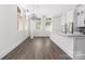 Modern kitchen with stainless steel appliances, center island, and hardwood floors at 229 N Church St # 100, Charlotte, NC 28202