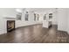 Spacious open-concept area with a fireplace, kitchen island, high ceilings, and large windows at 229 N Church St # 100, Charlotte, NC 28202