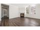 Spacious living room featuring hardwood floors, fireplace and large windows at 229 N Church St # 100, Charlotte, NC 28202