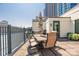 Outdoor patio featuring dining furniture, landscaping and city views in the background at 229 N Church St # 100, Charlotte, NC 28202