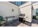 Outdoor patio featuring a grill, prep table, and landscaping with city views in the background at 229 N Church St # 100, Charlotte, NC 28202