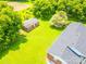 Aerial view of a single Gathering home with a sprawling green lawn and mature trees at 24132 Nc Hwy 73 Hwy, Albemarle, NC 28001