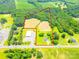 Expansive aerial view showcasing the property's boundaries, including fields and structures at 24132 Nc Hwy 73 Hwy, Albemarle, NC 28001