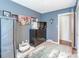 Comfortable bedroom with carpet, dresser, and a closet for storage at 24132 Nc Hwy 73 Hwy, Albemarle, NC 28001