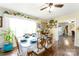 Inviting dining room with a large window, decorative shelves, and a view into another room at 24132 Nc Hwy 73 Hwy, Albemarle, NC 28001
