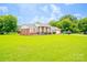 Charming single-story brick home with a well-manicured lawn and attached garage at 24132 Nc Hwy 73 Hwy, Albemarle, NC 28001