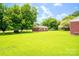 Charming single-story brick home with a well-manicured lawn and mature trees at 24132 Nc Hwy 73 Hwy, Albemarle, NC 28001