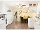 Cozy kitchen with white cabinets, dining table, and view into other rooms at 24132 Nc Hwy 73 Hwy, Albemarle, NC 28001