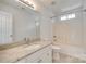Clean bathroom featuring a shower-tub combo, neutral paint, and a granite countertop vanity at 2830 Grosbeak Ln, Charlotte, NC 28269