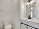 Cozy half bath features a modern vanity with white countertop and sliding barn door at 2830 Grosbeak Ln, Charlotte, NC 28269