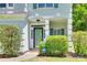 Close-up on a home's entrance, showing its neat landscaping and protected by ADT security at 2830 Grosbeak Ln, Charlotte, NC 28269