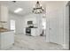 Stylish kitchen with white cabinetry, granite countertops, and stainless steel appliances, efficient layout at 2830 Grosbeak Ln, Charlotte, NC 28269