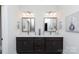 Bathroom with dual vanity, granite countertops, stylish lighting, and decorative mirrors at 3006 Constitution Ln, Gastonia, NC 28056