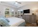 Bedroom with a tray ceiling, lots of light, and neutral, stylish decor at 3006 Constitution Ln, Gastonia, NC 28056