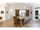 Bright dining room with wood floors, statement lighting and sliding barn doors to another room at 3006 Constitution Ln, Gastonia, NC 28056