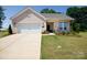 Charming one-story home with a well-manicured lawn and brick facade, creating curb appeal at 3006 Constitution Ln, Gastonia, NC 28056