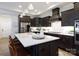 Bright kitchen features a large island, stainless steel appliances and plenty of storage at 3006 Constitution Ln, Gastonia, NC 28056