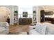 Inviting living room featuring stylish built-ins, hardwood floors, and a comfortable seating area at 3006 Constitution Ln, Gastonia, NC 28056
