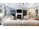 Bright living room with a cozy fireplace, built-in shelving, neutral colors, and modern furnishings at 3006 Constitution Ln, Gastonia, NC 28056