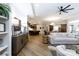 Spacious open-concept living room with hardwood floors, modern decor, and seamless flow to the kitchen at 3006 Constitution Ln, Gastonia, NC 28056