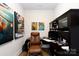 Home office with custom built-ins, a comfortable chair, and stylish decor at 3006 Constitution Ln, Gastonia, NC 28056