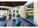 Relaxing patio space featuring a comfortable sofa, an outdoor dining set, and beautiful landscaping at 3006 Constitution Ln, Gastonia, NC 28056