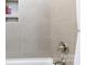 Tiled shower showcasing a built-in niche for storage and a sleek chrome faucet at 3006 Constitution Ln, Gastonia, NC 28056