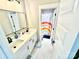 Cozy bathroom featuring double sinks, modern fixtures, and stylish design, offering a functional and appealing space at 305 Pleasant Hill Se Dr, Concord, NC 28025