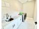 Functional laundry room with modern washer and dryer, featuring ample counter space and storage for laundry essentials at 305 Pleasant Hill Se Dr, Concord, NC 28025