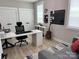 Bright office with a large desk, sofa, guitar, and ample storage, perfect for productivity and relaxation at 305 Pleasant Hill Se Dr, Concord, NC 28025