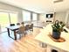 Open floor plan with kitchen island, dining table, and view into the living room at 305 Pleasant Hill Se Dr, Concord, NC 28025