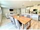 Spacious open floor plan with dining area, living room fireplace, and white kitchen at 305 Pleasant Hill Se Dr, Concord, NC 28025