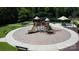 Elevated view of a playground featuring slides, climbing structures, and benches in a landscaped park at 305 Pleasant Hill Se Dr, Concord, NC 28025