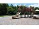 Playground includes slides, climbing features, and benches surrounded by a wood chip surface at 305 Pleasant Hill Se Dr, Concord, NC 28025