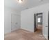 Light and bright bedroom featuring neutral carpet and a double door closet at 3296 Saddlebrook Dr, Midland, NC 28107