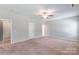 Large bedroom with ceiling fan and several doors at 3296 Saddlebrook Dr, Midland, NC 28107