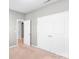 Neutral bedroom showcasing plush carpet, double door closet, and adjoining room access at 3296 Saddlebrook Dr, Midland, NC 28107